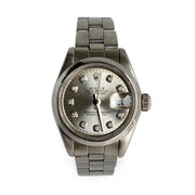 Rolex lady datejust watch with diamond-studded face on a white background