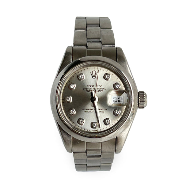 Rolex lady datejust watch with diamond-studded face on a white background
