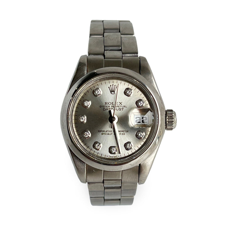 Rolex lady datejust watch with diamond-studded face on a white background