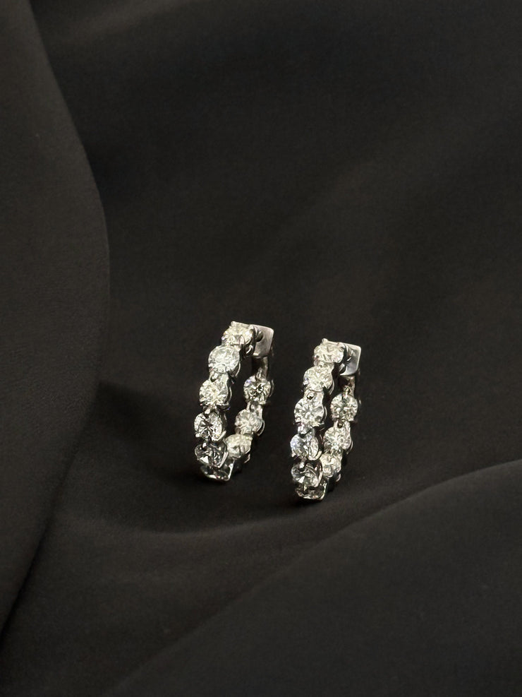 18K white gold inside-out diamond hoop earrings featuring 5.14 total carats of round brilliant cut diamonds