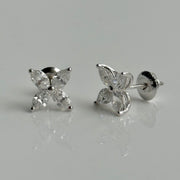 Elegant diamond stud earrings featuring marquise-cut stones on white background