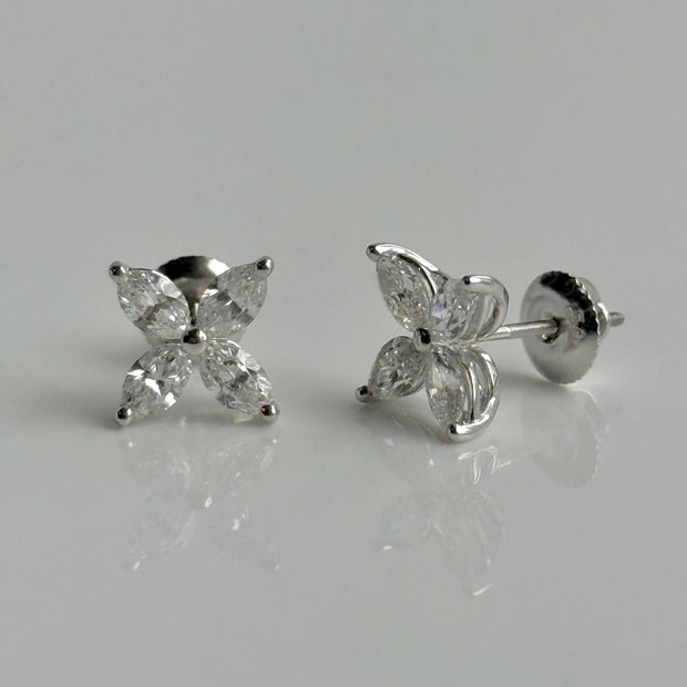 Elegant diamond stud earrings featuring marquise-cut stones on white background