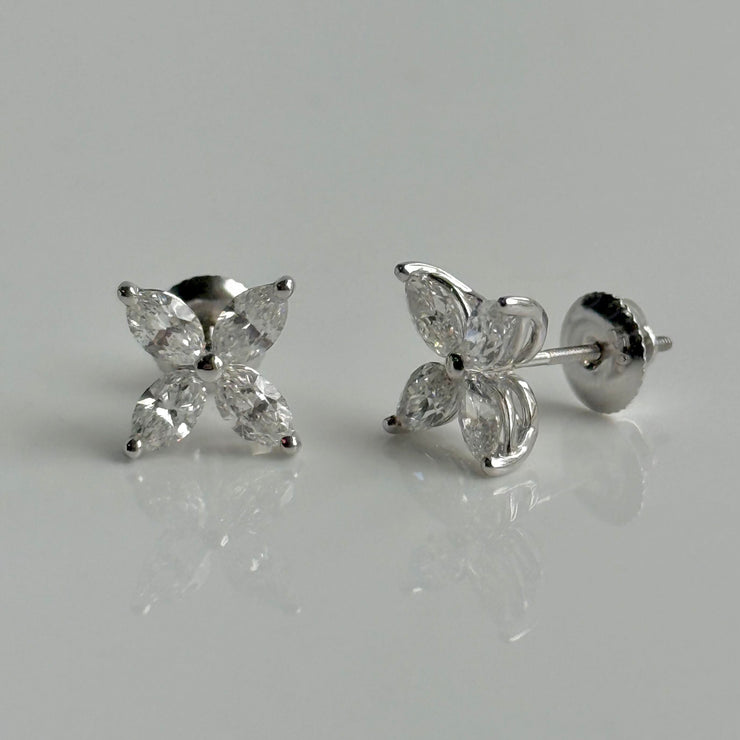 Elegant diamond stud earrings featuring marquise-cut stones on white background