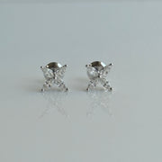 Pair of floral marquise diamond stud earrings arranged in a delicate petal design