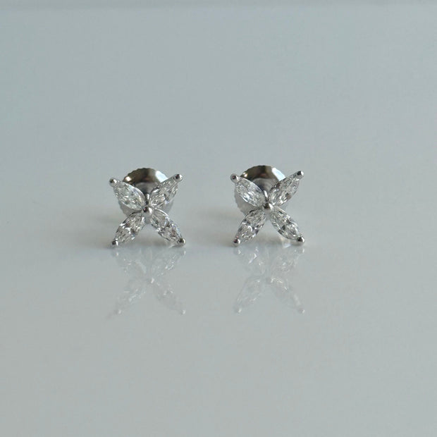 Pair of floral marquise diamond stud earrings arranged in a delicate petal design