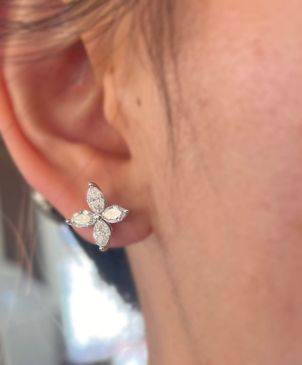 Luxury marquise diamond earrings in 18K white gold worn by a model