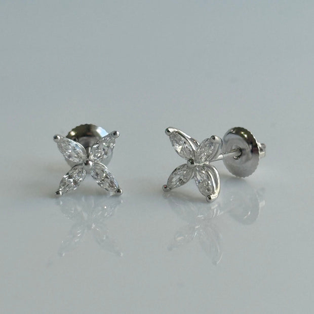 Pair of floral diamond stud earrings arranged in a delicate petal design

