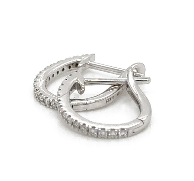 Beautifully designed 0.15 CTW Diamond Mini Hoops in 18K white gold, showcasing their secure back closure.