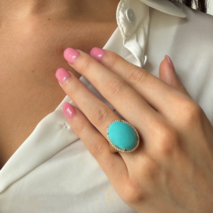 A remarkable 26.86 carat oval cabochon turquoise that radiates vivid color and natural beauty. 