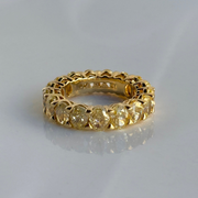 Gold eternity ring with oval fancy yellow diamond stones 