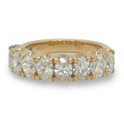 Oval Diamond Half Eternity Ring in 18K yellow gold, featuring a captivating array of 2.18 carats of shimmering oval diamonds.