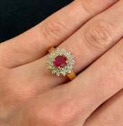 Oval Ruby Ring with Double Diamond Halo