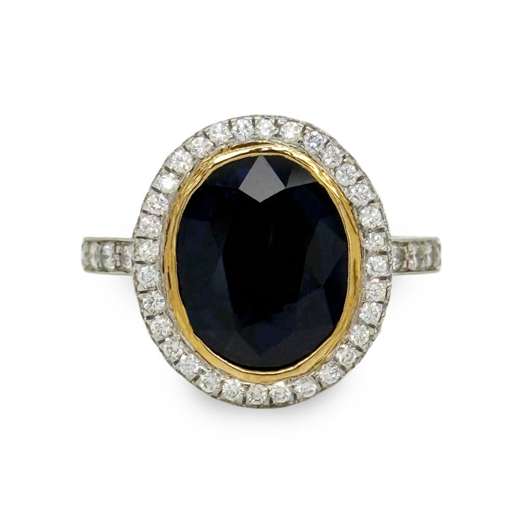 Bezel-set 6.60 ct oval sapphire and 2.00 ctw diamond ring in platinum with yellow gold