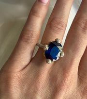 Two Tone Oval Cut Sapphire with Diamonds Ring