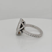 Luxury sapphire and diamond ring featuring a bezel-set 6.60 ct oval blue sapphire with diamond accents