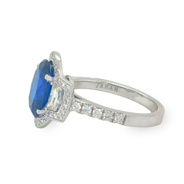 Side view of the 3.49ct oval cut sapphire and diamond ring, showcasing the sleek 18K white gold setting and the brilliance of the surrounding diamonds.