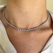 Stunning tennis necklace shown on model.