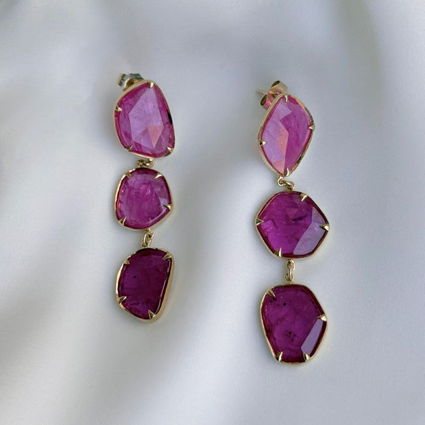Luxury ruby drop earrings featuring untreated ruby slices in bezel and prong setting