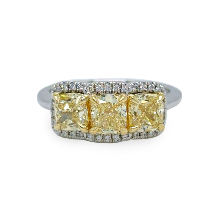 Three-stone ring with 2.22 carats of Fancy Yellow diamonds and 0.11 carats of round brilliant diamonds, set in 18K yellow and white gold.