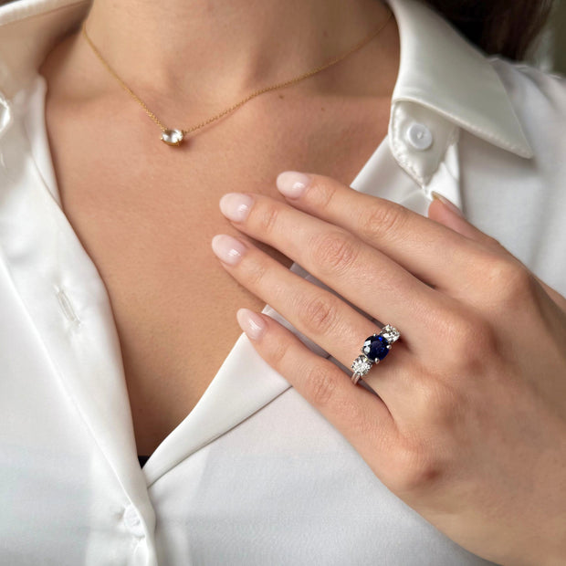 Blue Sapphire and Diamond Three Stone Ring