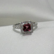 Pink tourmaline halo ring with diamonds halfway around band