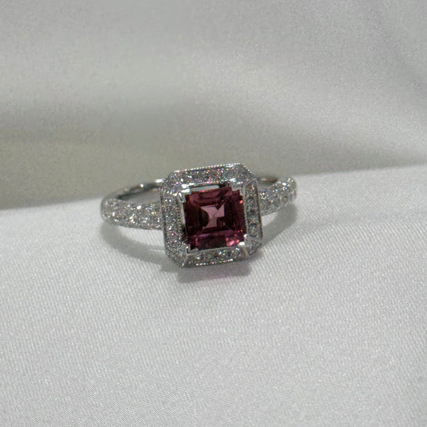 Pink tourmaline halo ring with diamonds halfway around band