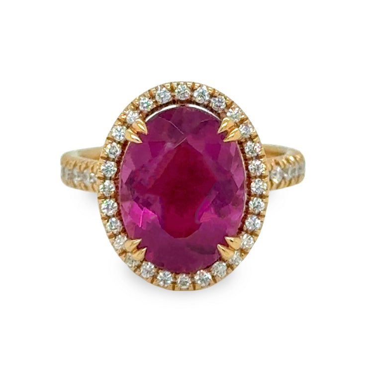 4.67 carat oval tourmaline ring in 18k rose gold with a halo of round brilliant cut diamonds, showcasing a deep, rich hue and elegant design.