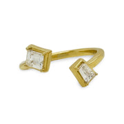 Bypass ring in 18K yellow gold with emerald cut and baguette diamond accents