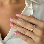 Modern two shape diamond bypass ring worn by a model