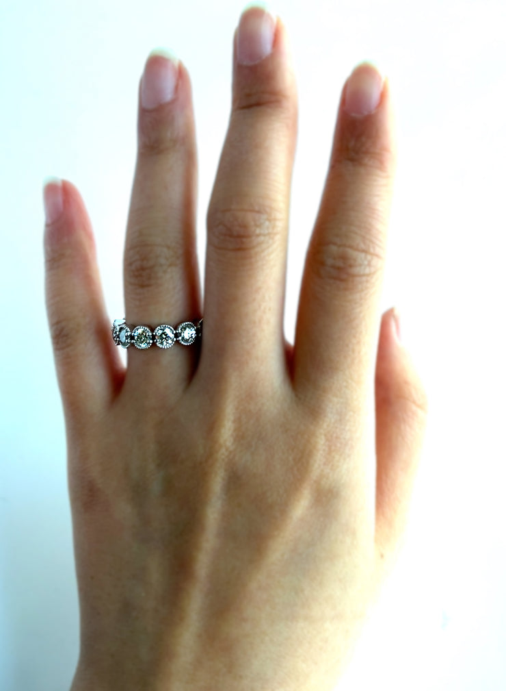 Natural round brilliant diamonds sparkle on the hand.