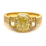 Stunning three stone yellow diamond ring set in yellow gold with a matte finish.