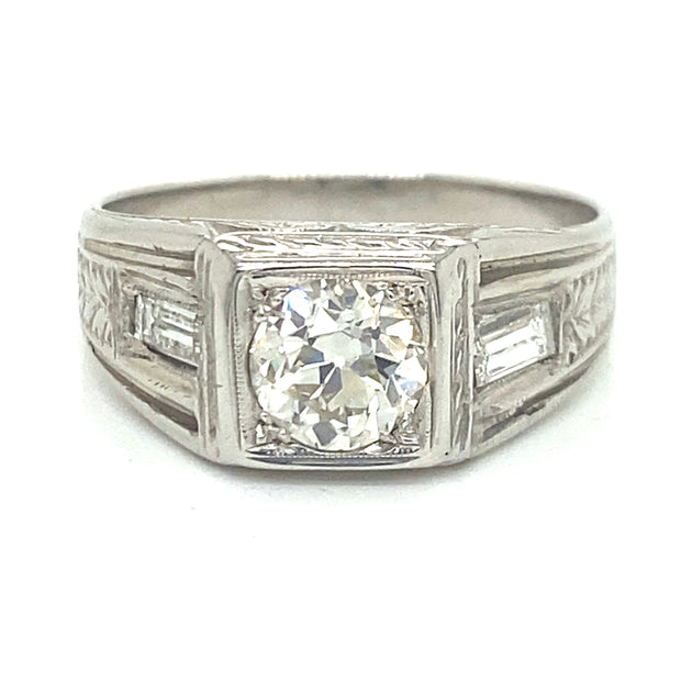 Front view detailing a round center diamond with flanking baguette diamonds.