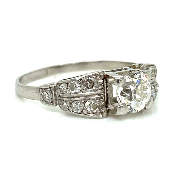 Antique Ring with Approximately 0.80 ct Round Diamond Center Stone and 0.30 ctw Side Diamonds set in Platinum