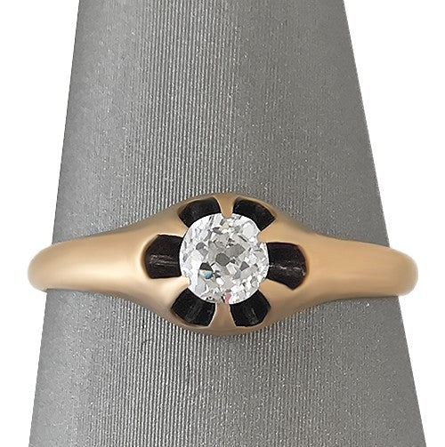 Front view of the belcher-set Old Mine Cut diamond against the soft matte finish of the gold band.