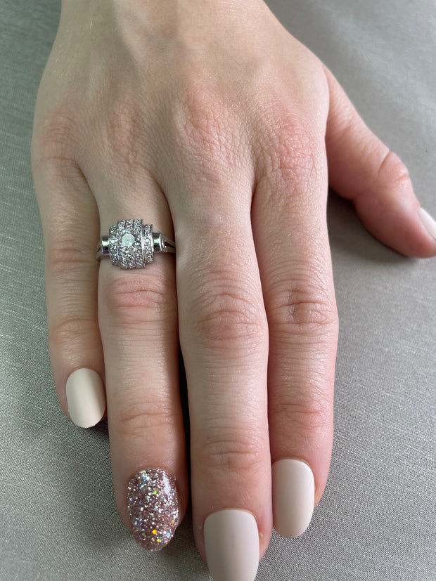 Worn on hand to illustrate scale and the ring’s timeless beauty.
