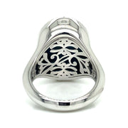 Intricate metalwork on the back of turquoise and sapphire halo ring.

