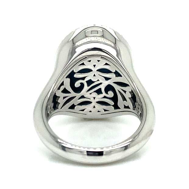 Intricate metalwork on the back of turquoise and sapphire halo ring.

