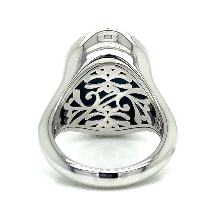 Intricate metalwork on the back of turquoise and sapphire halo ring.

