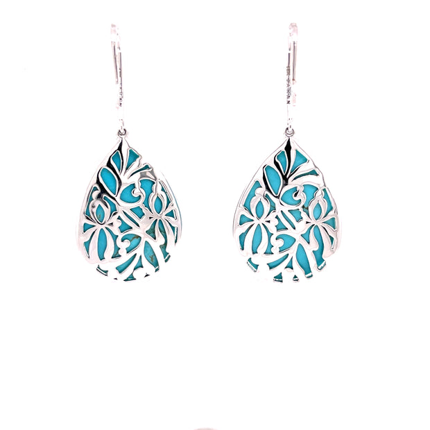 Back view of handcrafted turquoise and diamond dangle earrings with intricate details.