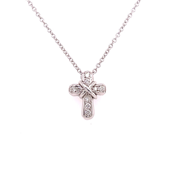 Diamond cross pendant shown in detail. 