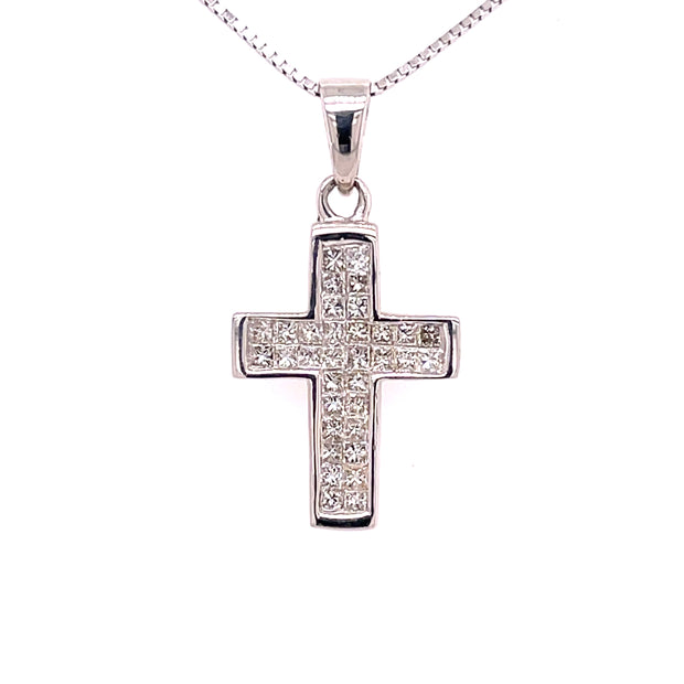 A close detail of this princess-cut diamond cross pendant.