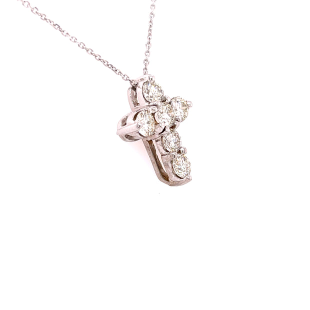 Diamond cross pendant shown from an angle.