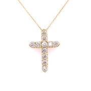 A 1.50 CTW diamond cross necklace set in 14K yellow gold.