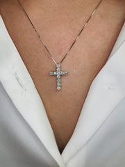 Diamond cross pendant shown on model.
