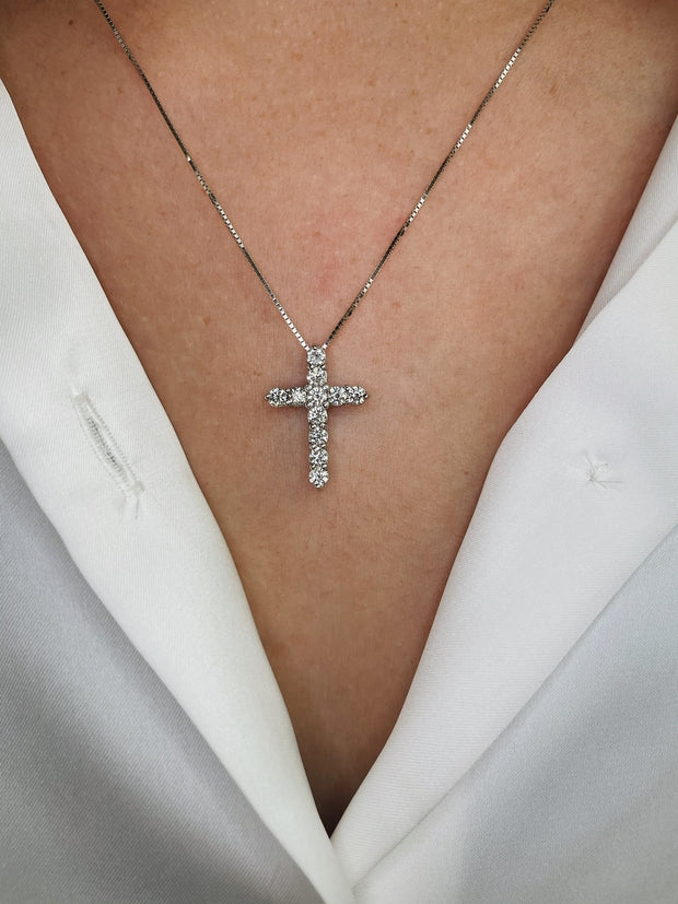 Diamond cross pendant shown on model.