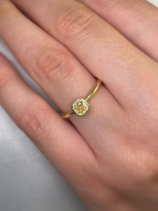 Bezel set fancy yellow diamond ring