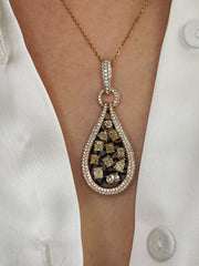 Yellow diamond pendant seen on model.