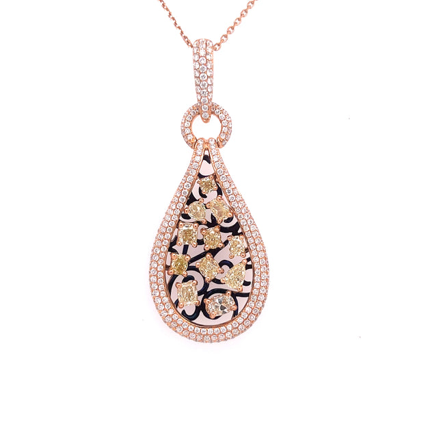 Rose gold pendant featuring fancy yellow diamonds and acented with natural round brilliant diamonds.