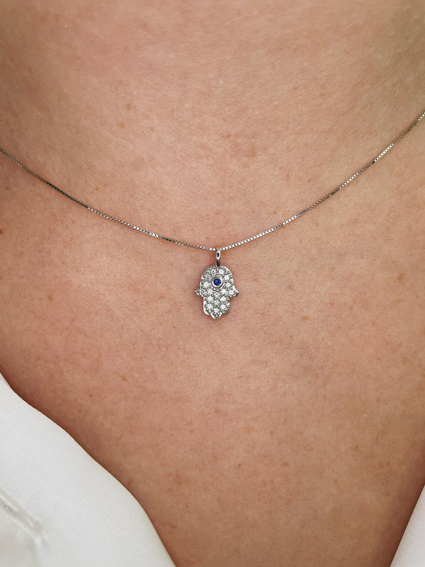 Delicate diamond and sapphire Hamsa pendant.