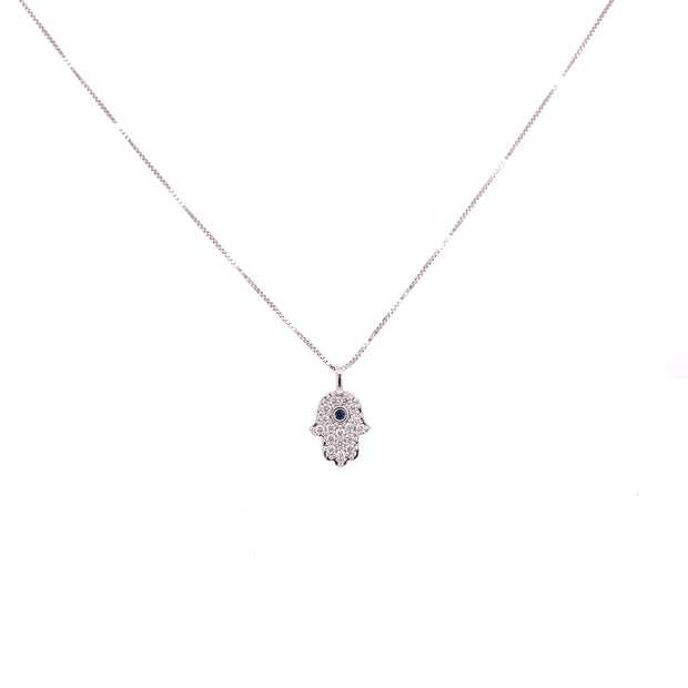 Diamond Hamsa pendant with brilliant blue sapphire at the center.